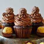 These Nutella Ferrero Rocher Cupcakes are ultra rich, super fudgy, moist, chocolaty and so delicious! The Nutella buttercream frosting is to die for! Such an easy and impressive cupcake!