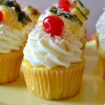 These Pina Colada Cupcakes taste like a tropical vacation in one moist and flavorful cupcake! Juicy pineapple cupcakes and a creamy and decadent coconut buttercream complete these vacation-inspired treats!