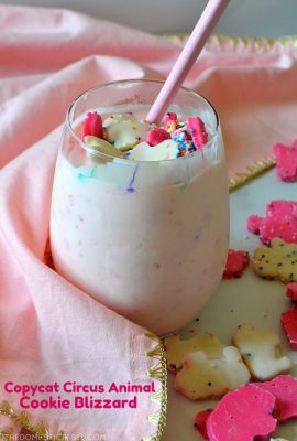 Circus Animal Cookie Blizzard in glass with pink towel and cookies