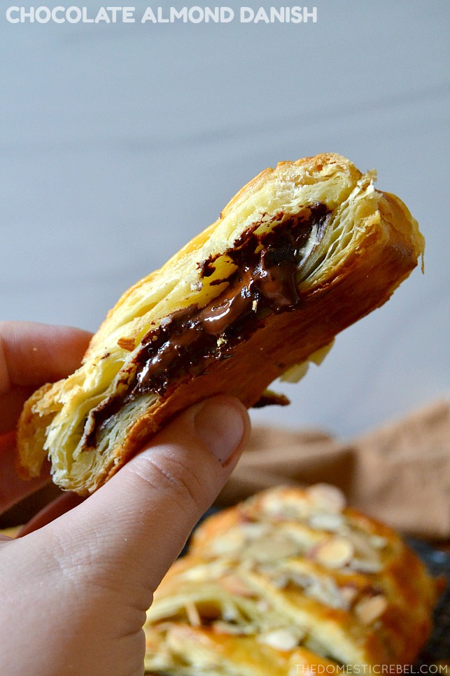 photo of author holding a piece of a chocolate almond danish pastry