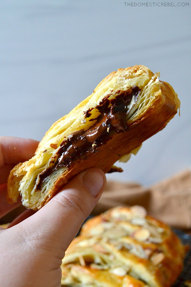 photo of author holding a piece of chocolate almond pastry