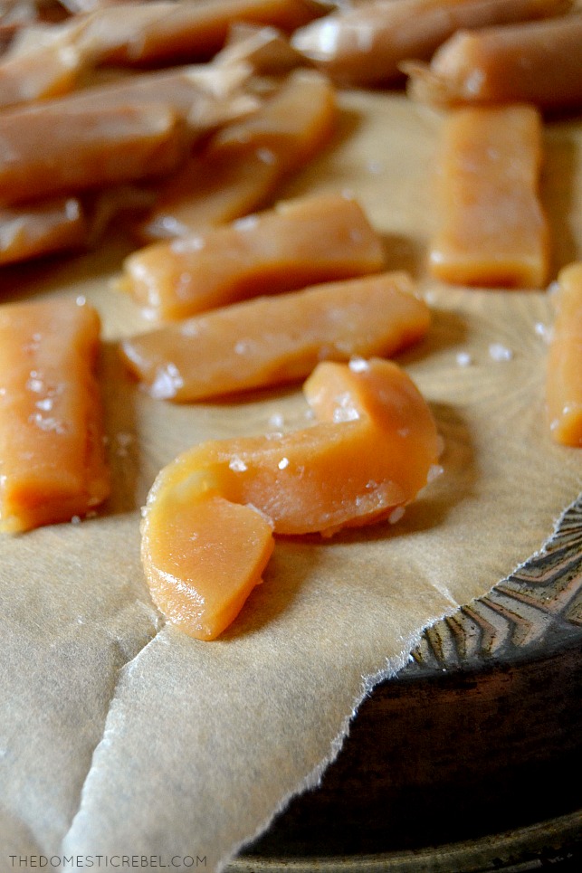 Pieces of salted caramels on a piece of parchment paper