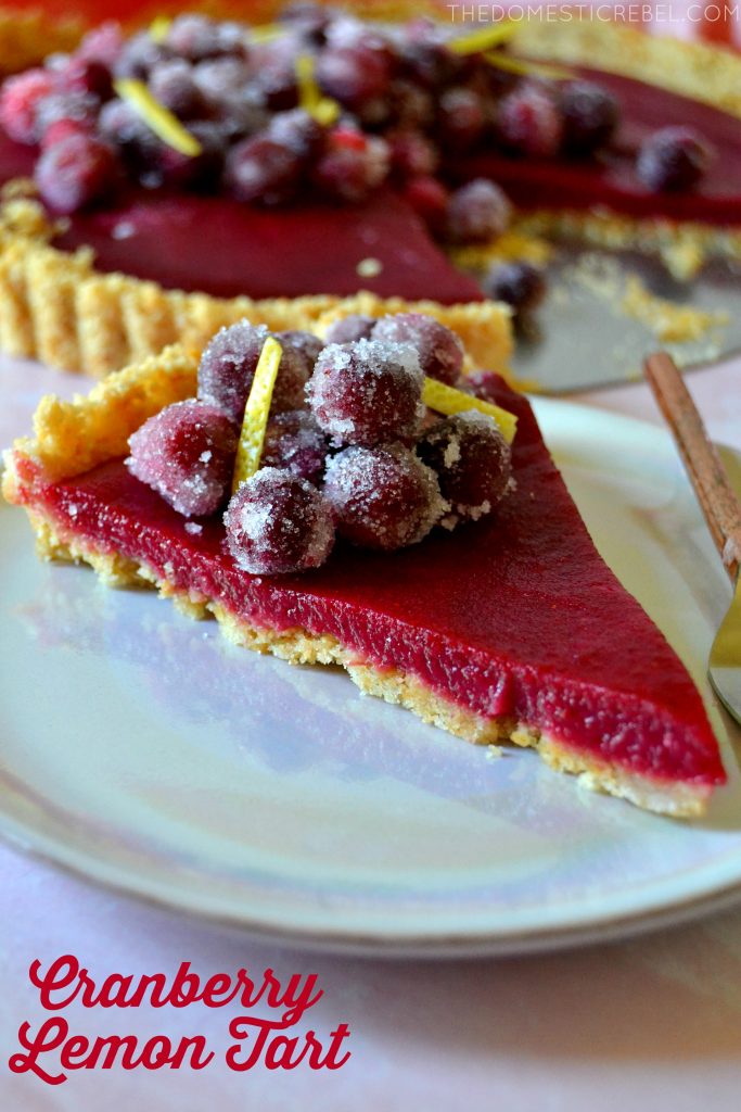 Slice of Cranberry Lemon Tart on a purple pink plate with a fork