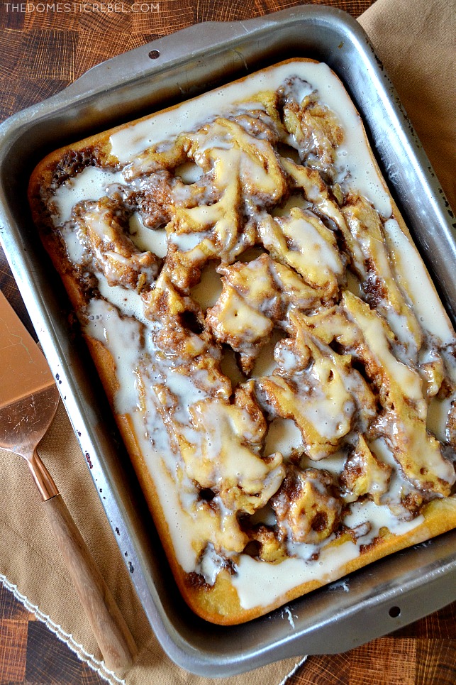 Photo of Cinnamon Roll Cake in a silver pan on brown towel