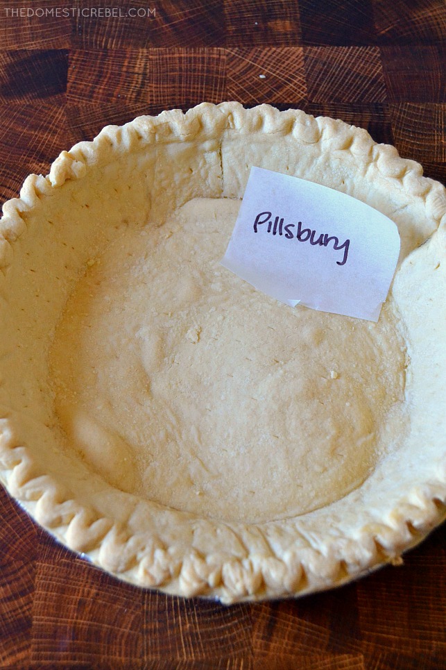 Pillsbury pie crust in pan on wood background