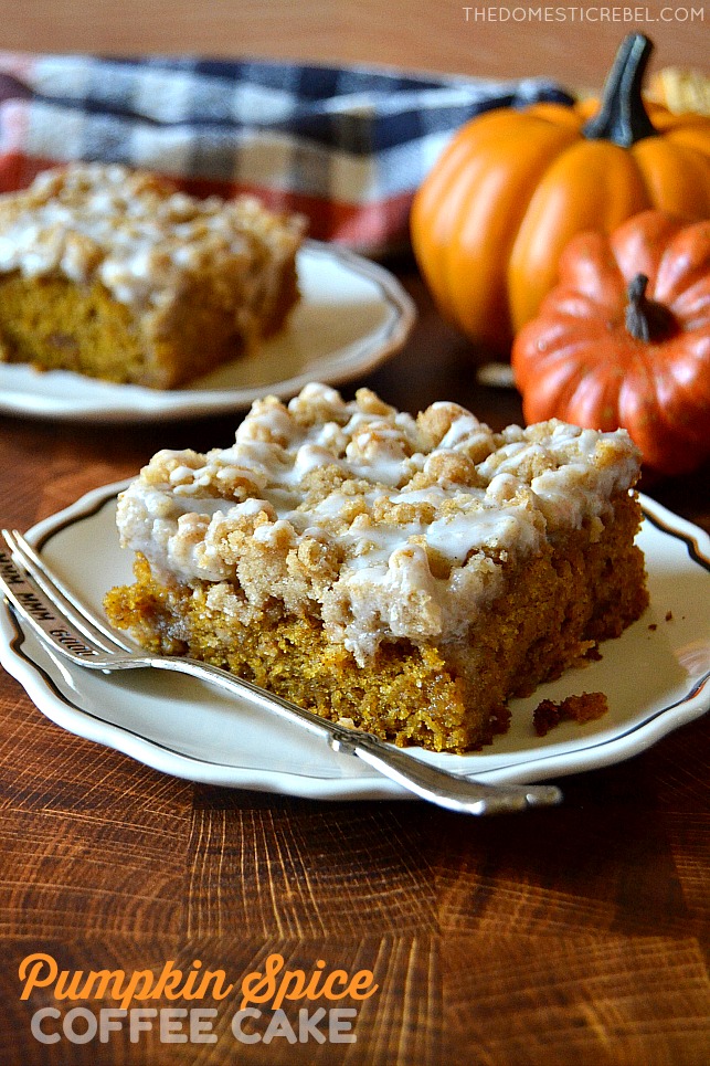 Pumpkin Spice Coffee Cake on white plate with fork and pumpkins in background