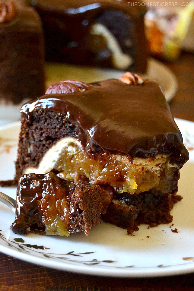 A gooey bite of chocolate pecan piecaken on a fork and a plate