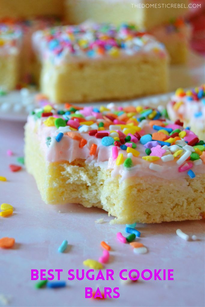 Bite missing on a sugar cookie bar with sprinkles