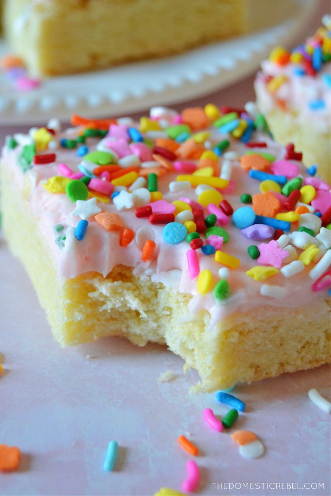 Closeup of a sugar cookie bar with a bite missing