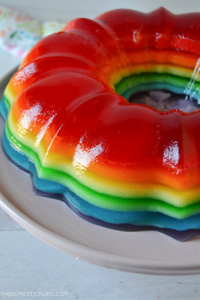Rainbow jello mold on a pink cake plate