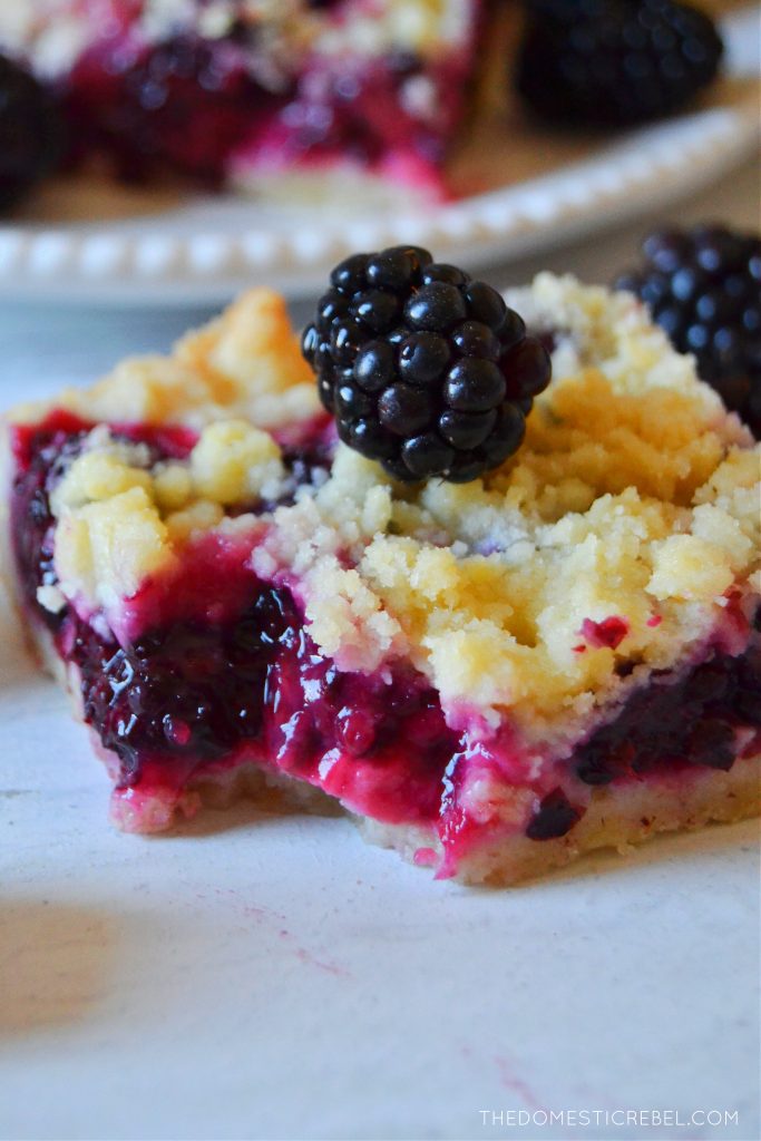 blackberry crumble bar with a bite missing