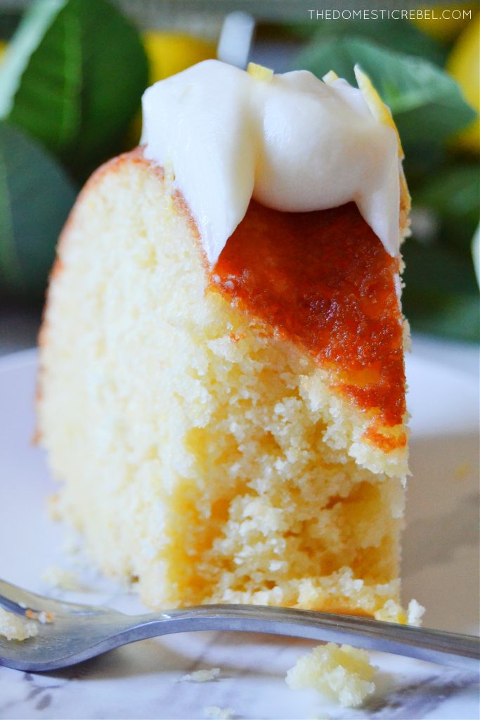 Closeup of lemon bundt cake with bite missing