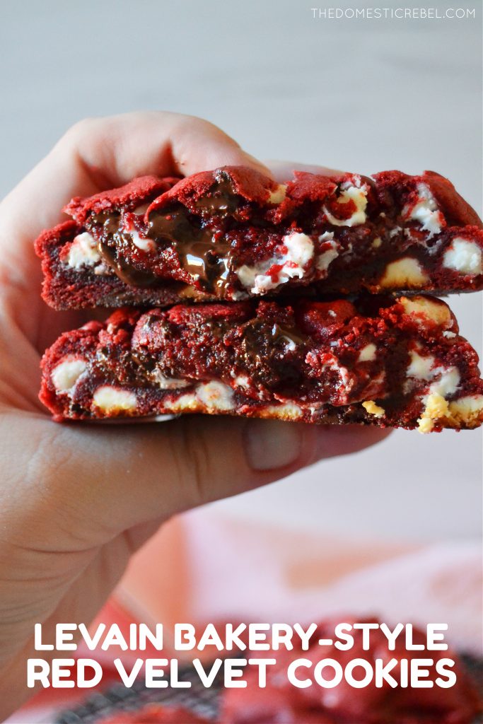 the author holding a split open red velvet bakery-style cookie