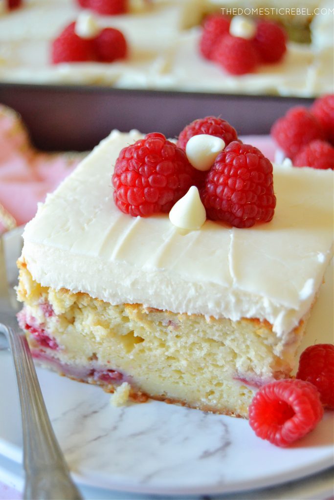 slice of white chocolate raspberry cake on a white plate