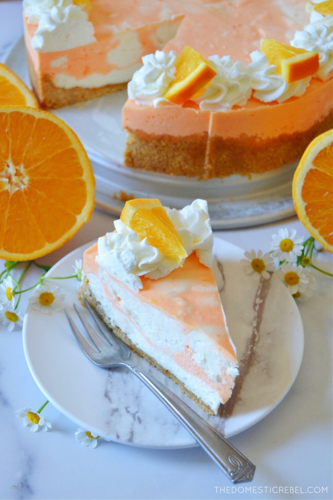 orange creamsicle cheesecake and a slice with oranges and flowers