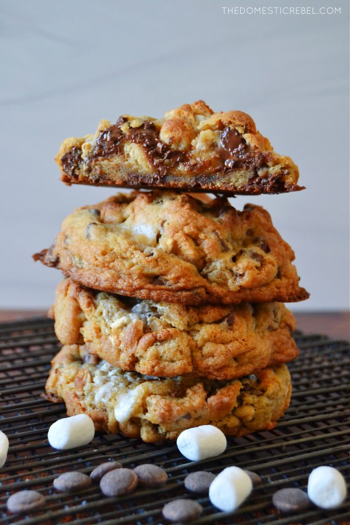 a four-high stack of s'mores cookies on a black wire rack
