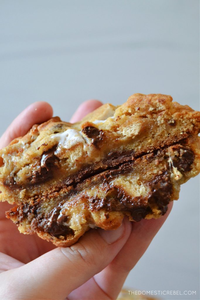 author holding a split open s'mores cookie