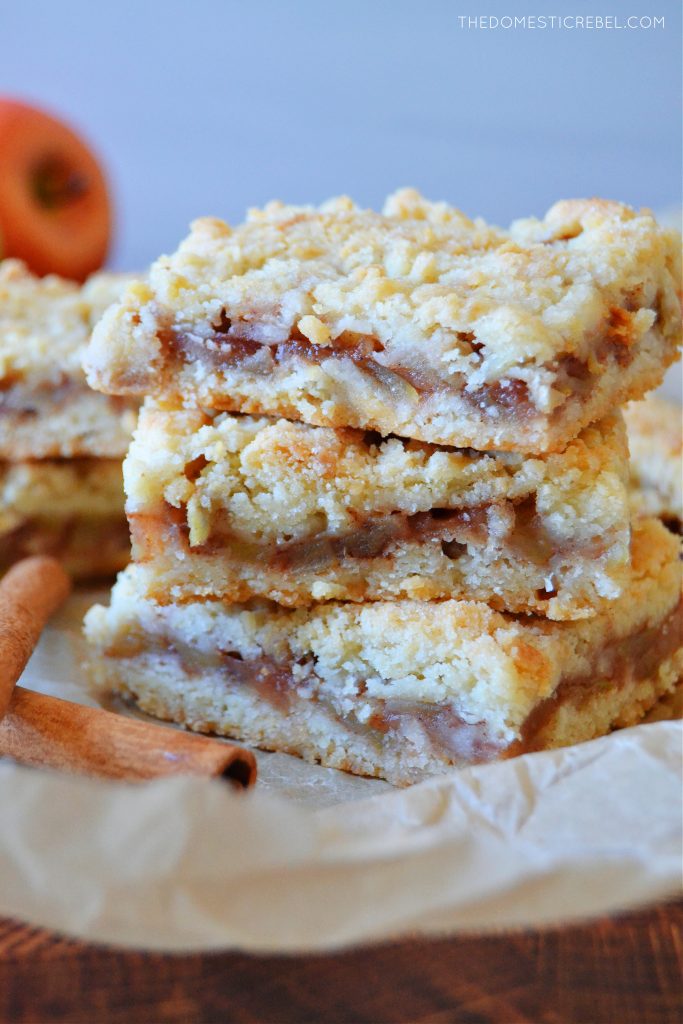 a triple stack tower of apple pie crumble bars on brown parchment