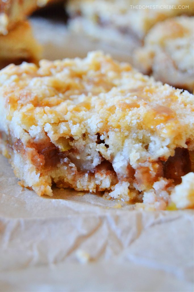 closeup of an apple pie crumble bar with a bite missing