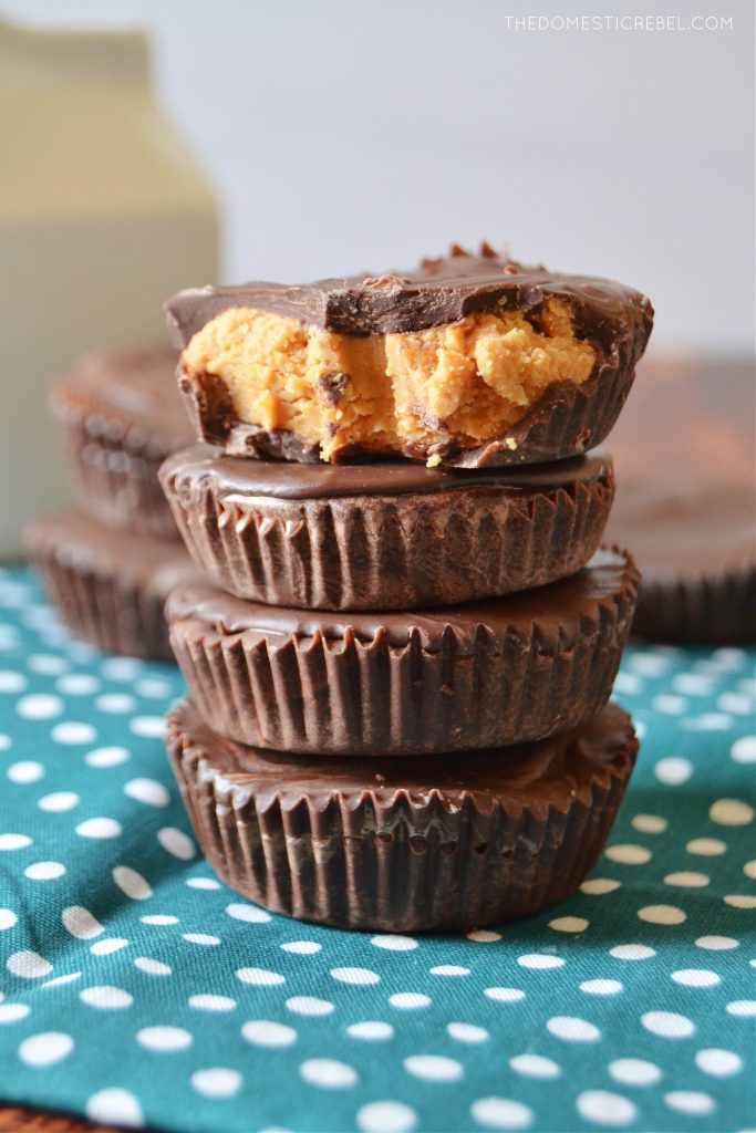 a quadruple stack of peanut butter cups with one missing a bite