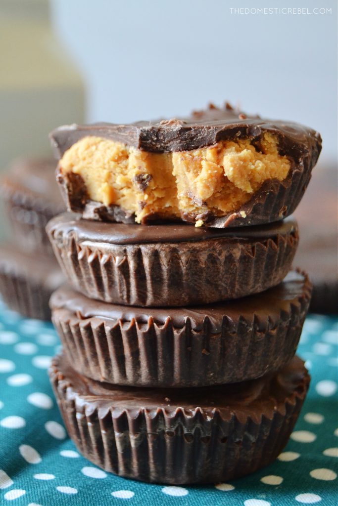 a four stack of peanut butter cups with one missing a bite