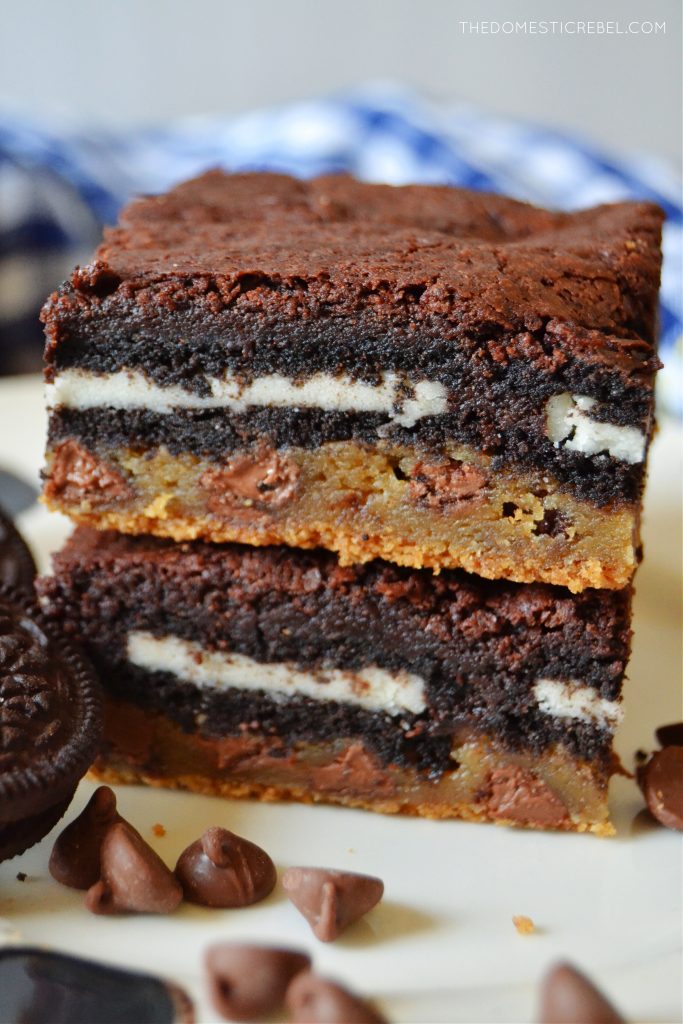 a closeup double stack of slutty brownies on a white plate