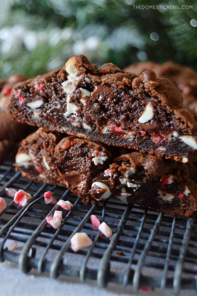 a closeup stack of chocolate peppermint cookies cut open to show texture 