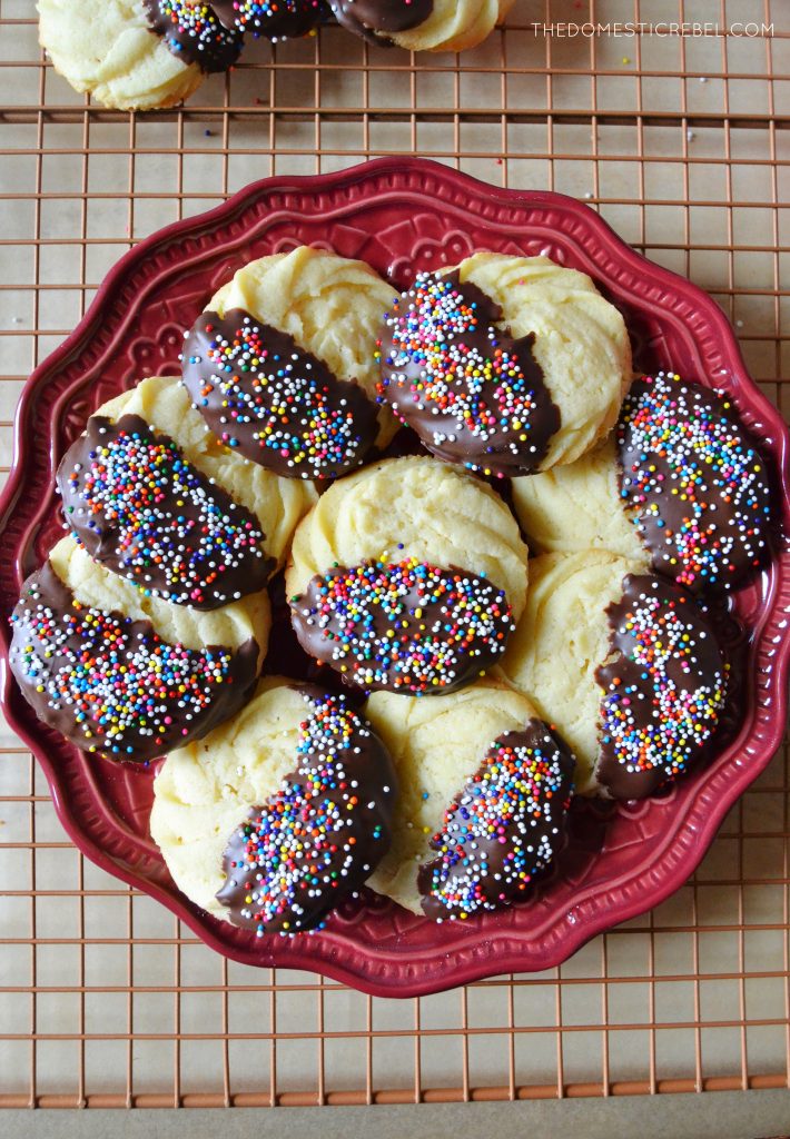 a ruby plate filled with chocolate-dipped butter cookies