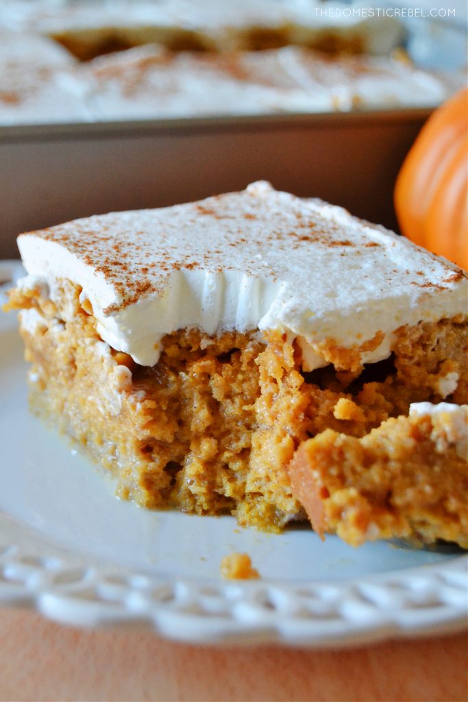 closeup slice of pumpkin tres leches cake with a bite missing