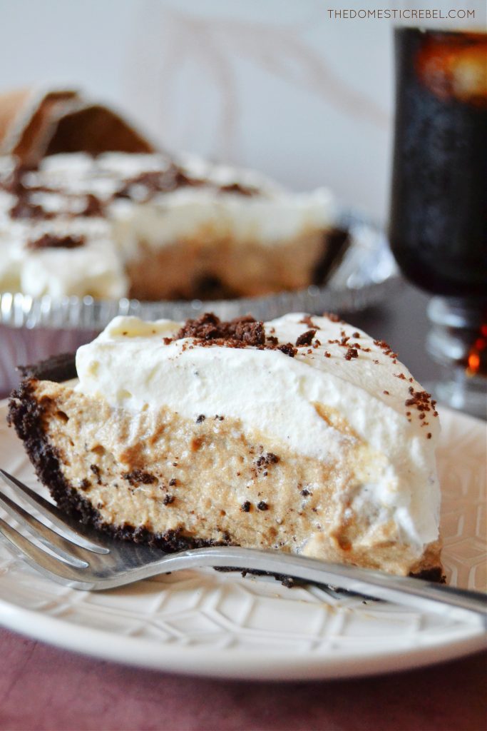 a side view of a slice of cold brew coffee pie on a white plate