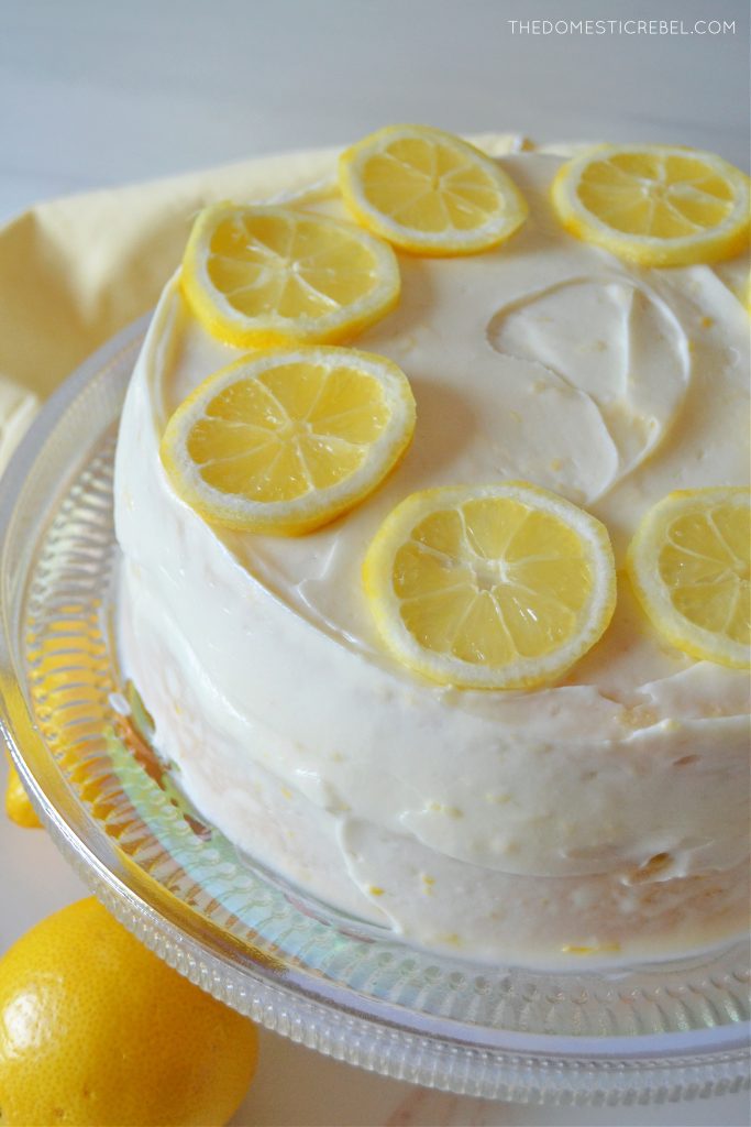 lemon layer cake on an iridescent cake plate