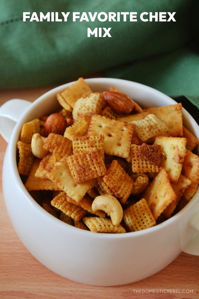 a closeup bowl of chex mix in a white bowl with a green towel in the background