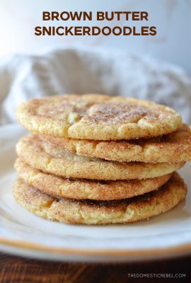 a mini stack of brown butter snickerdoodles on a white plate with a linen cloth in the background.