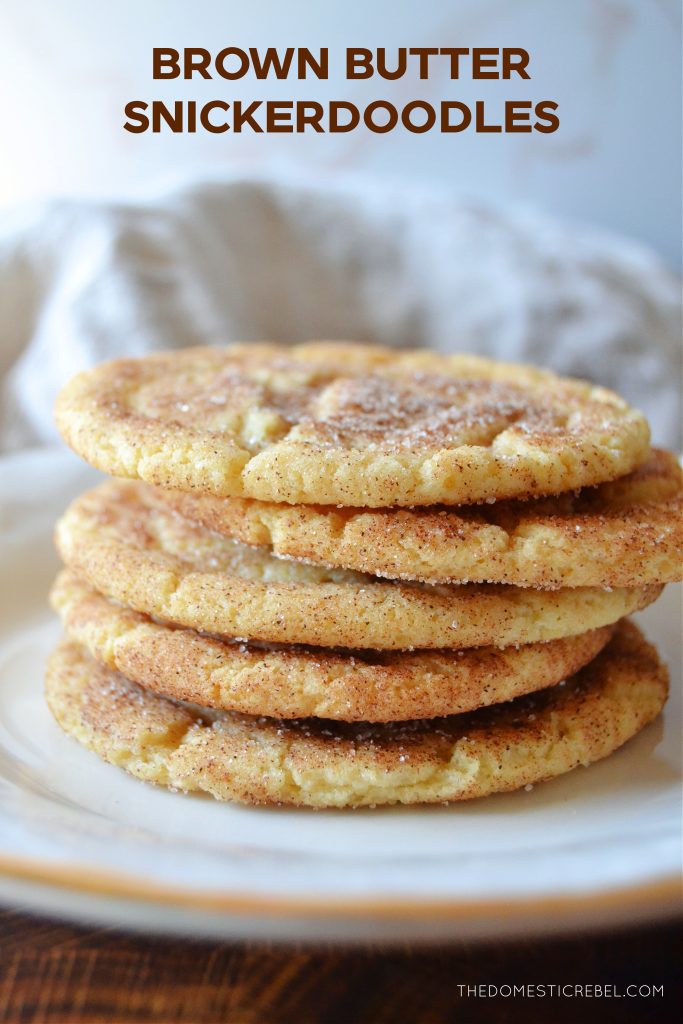a five-high stack of brown butter snickerdoodles on a white plate.