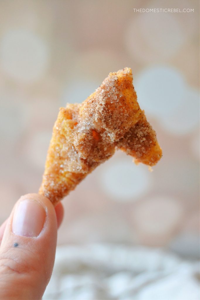 author holding up a cluster of churro toffee bugles to show the texture. 